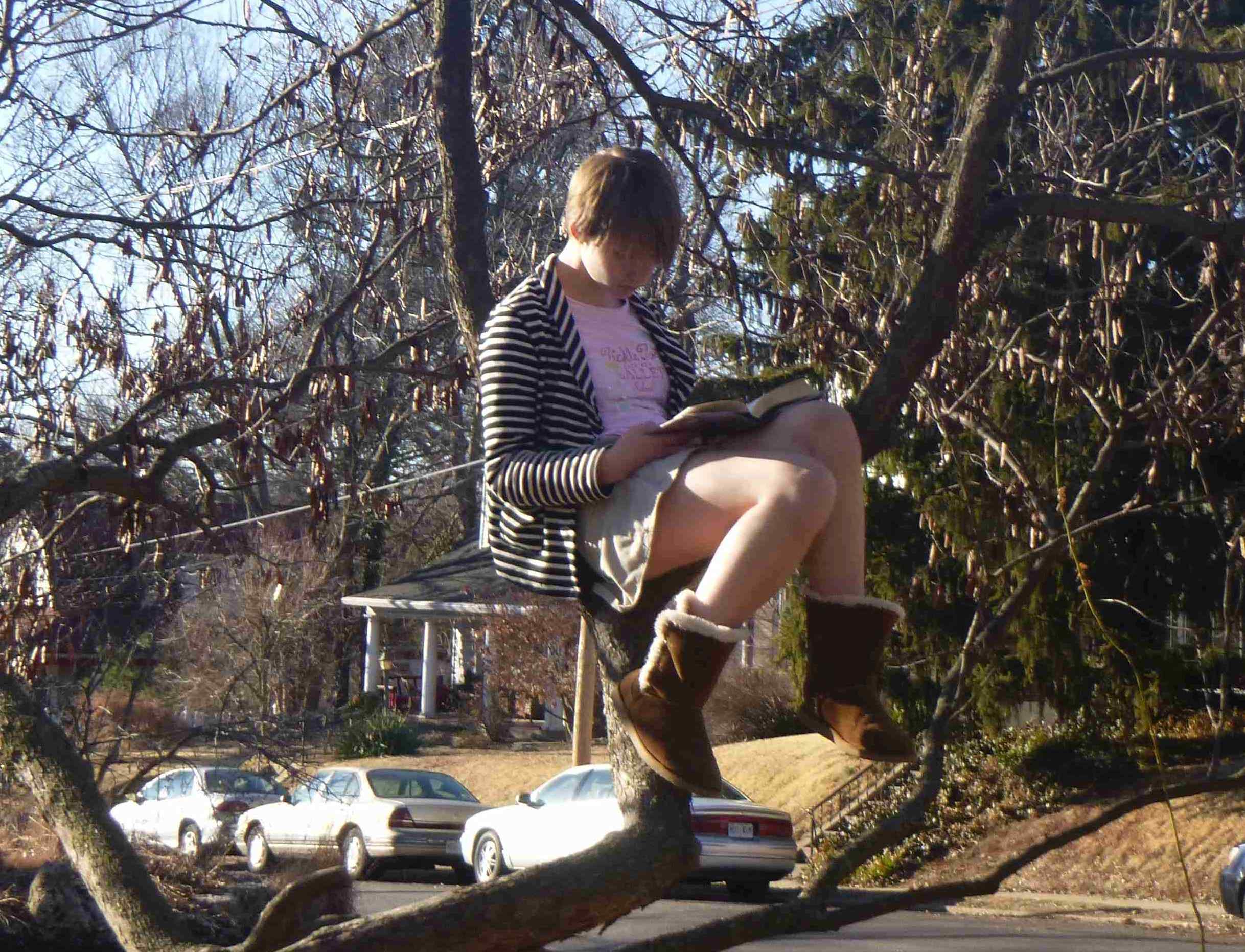 2015-03-07 Cate reading in the redbud.jpg